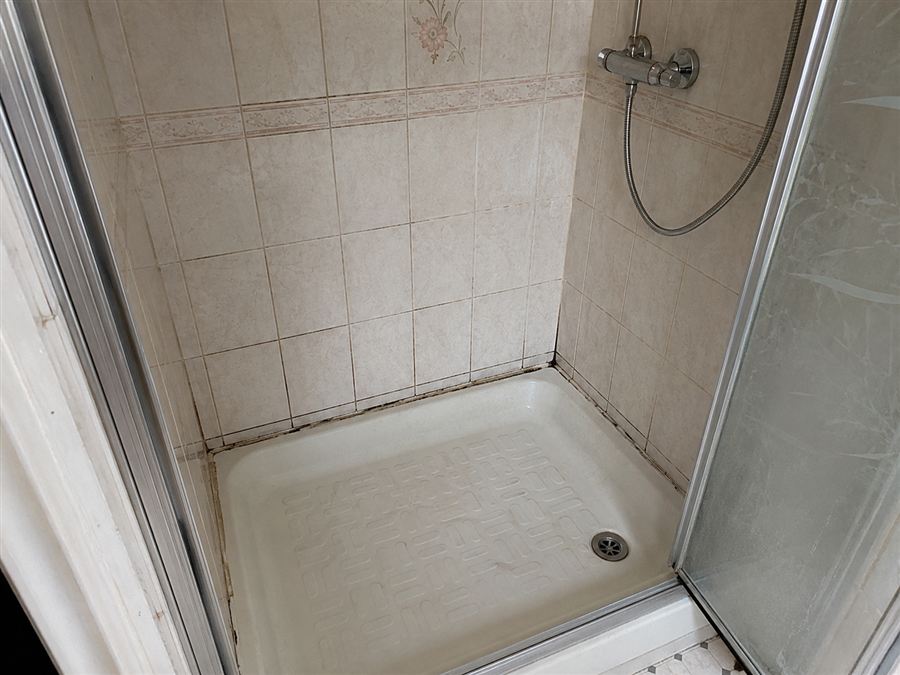 The shower area before work started
